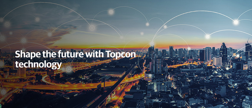 Shape the future with Topcon technology text over a busy city at night